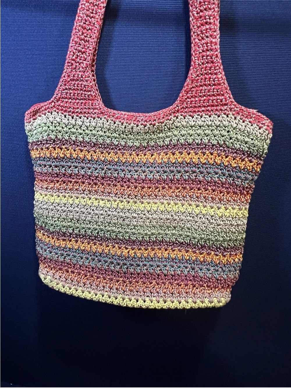 The Sak Multicolor Crochet Hobo Bag with Pink Straps tons of room and pockets